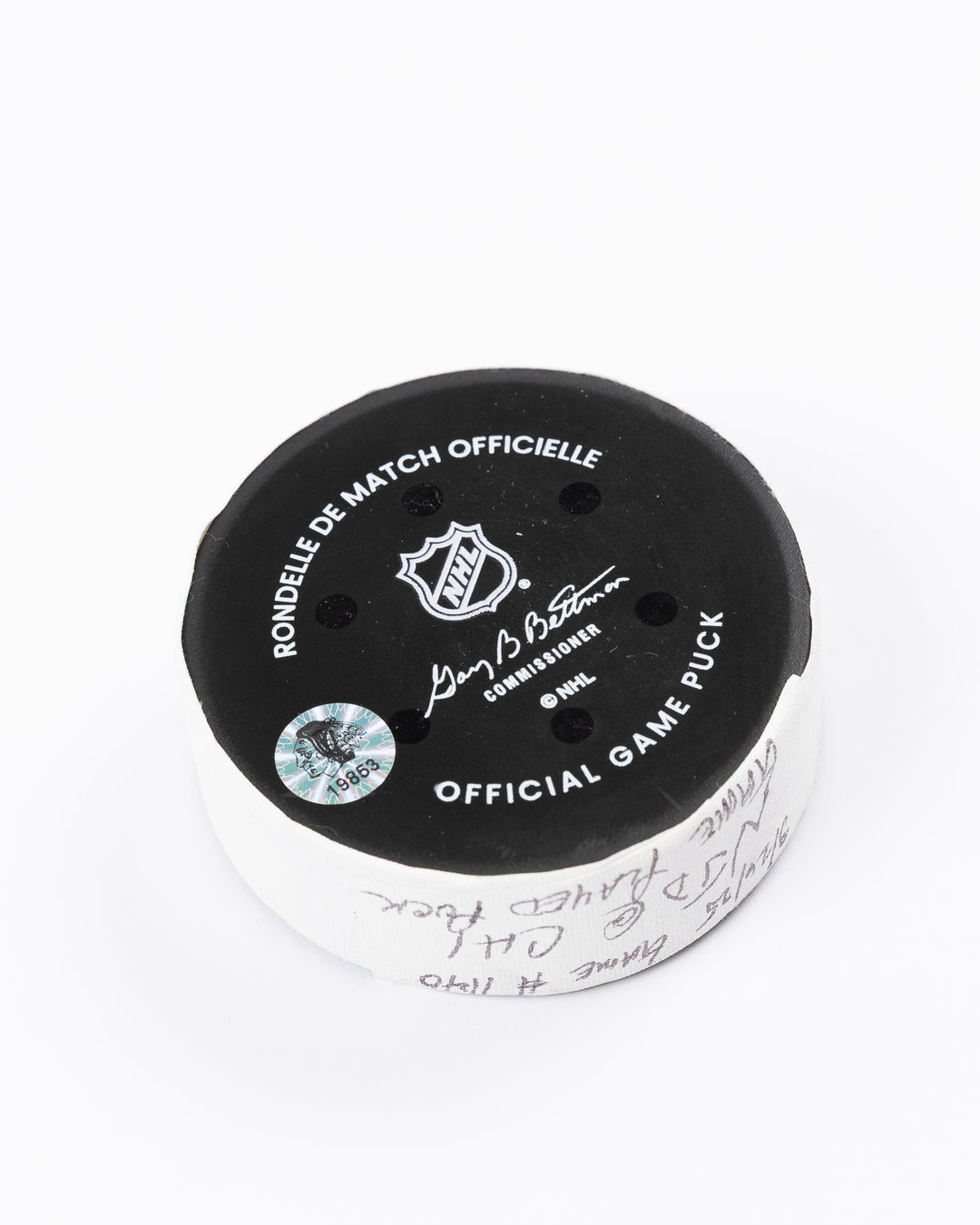 official Chicago Blackhawks hockey puck used in game against the New Jersey Devils on 3/26/25 - back angle lay flat
