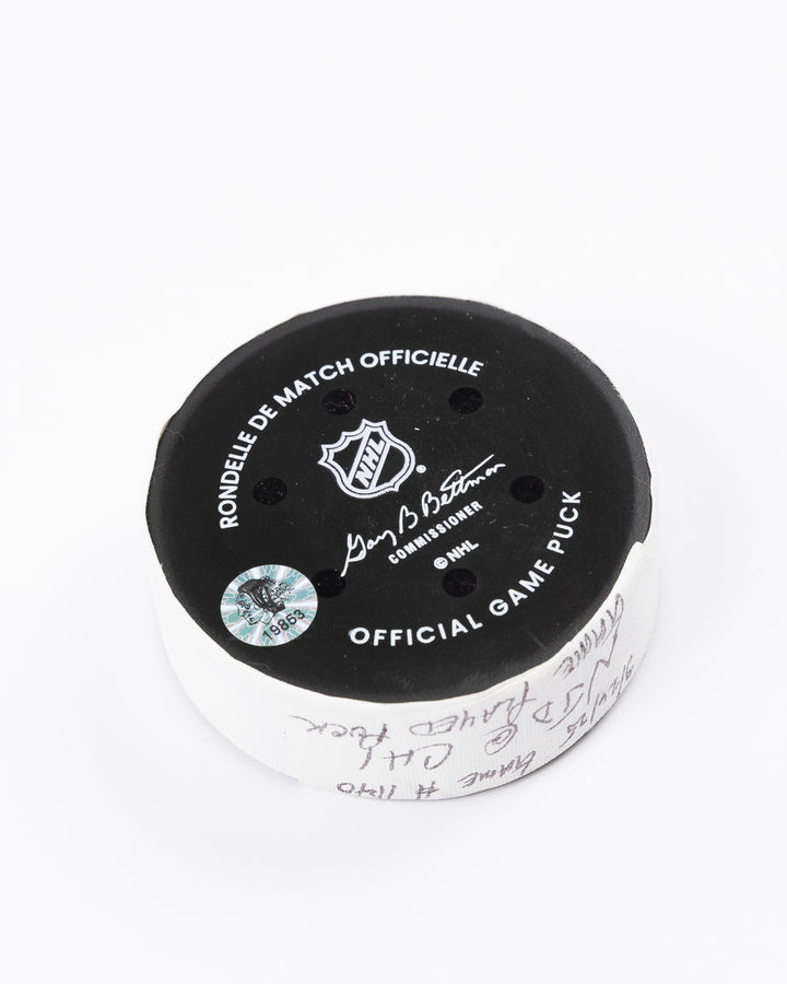 official Chicago Blackhawks hockey puck used in game against the New Jersey Devils on 3/26/25 - back angle lay flat