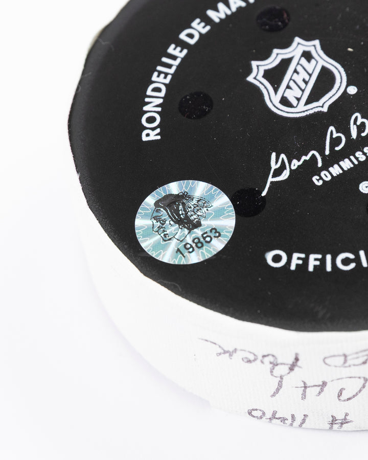 official Chicago Blackhawks hockey puck used in game against the New Jersey Devils on 3/26/25 - hologram sticker detail lay flat