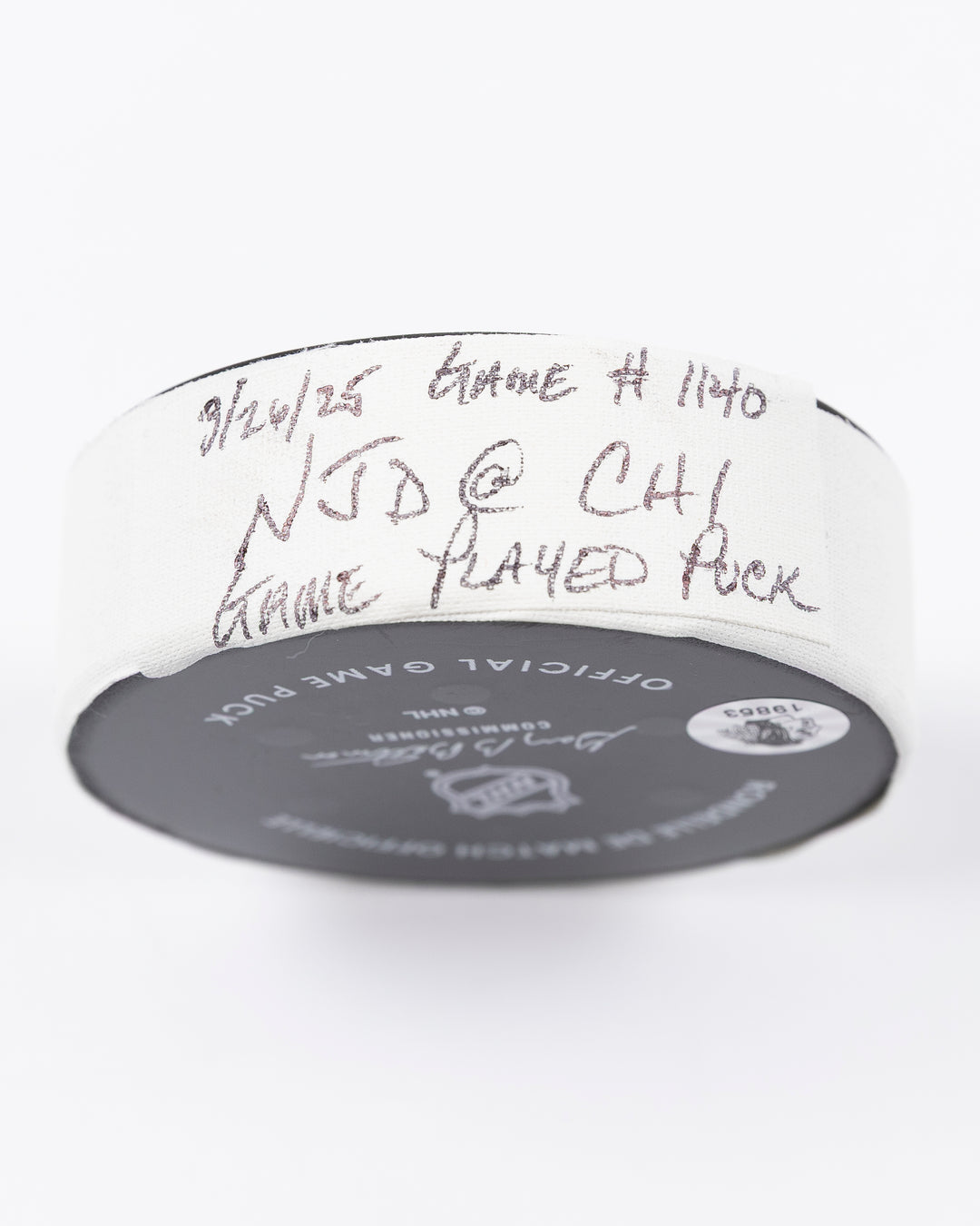 official Chicago Blackhawks hockey puck used in game against the New Jersey Devils on 3/26/25 - tape detail lay flat