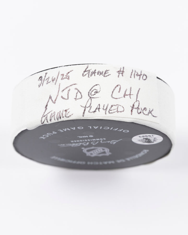official Chicago Blackhawks hockey puck used in game against the New Jersey Devils on 3/26/25 - tape detail lay flat