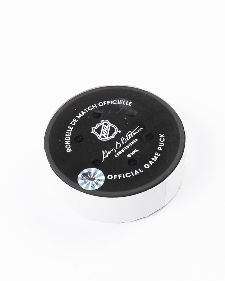 official Chicago Blackhawks hockey puck used in game against the Colorado Avalanche on 4/2/25 - back angle lay flat