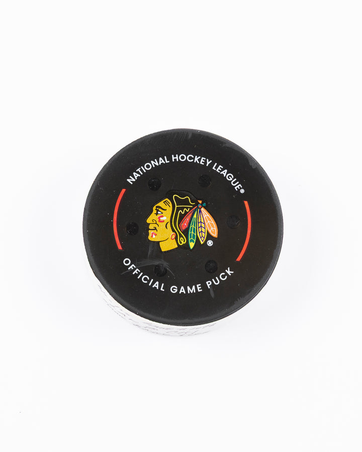 official Chicago Blackhawks hockey puck used in game against Los Angles Kings on 3/20/5 - front lay flat