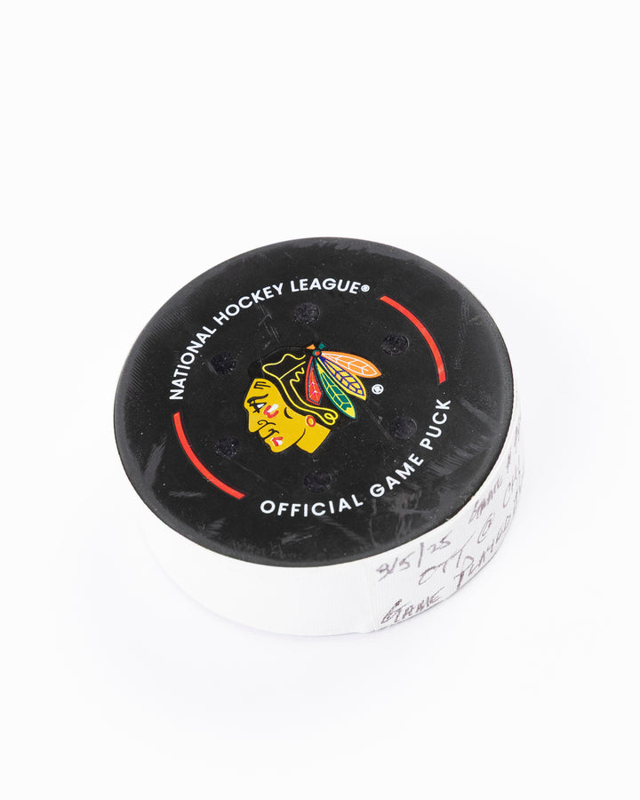 official Chicago Blackhawks game-used hockey puck against Ottawa Senators on March 5, 2025 - front angle lay flat