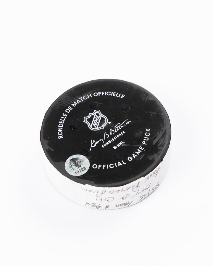 official Chicago Blackhawks game-used hockey puck against Ottawa Senators on March 5, 2025 - back angle lay flat