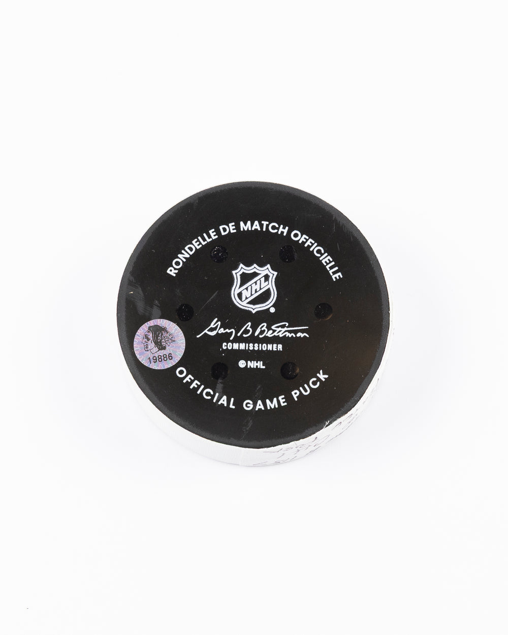 official Chicago Blackhawks hockey puck used in the game against the Vegas Golden Knights on 3/28/25 - back lay flat