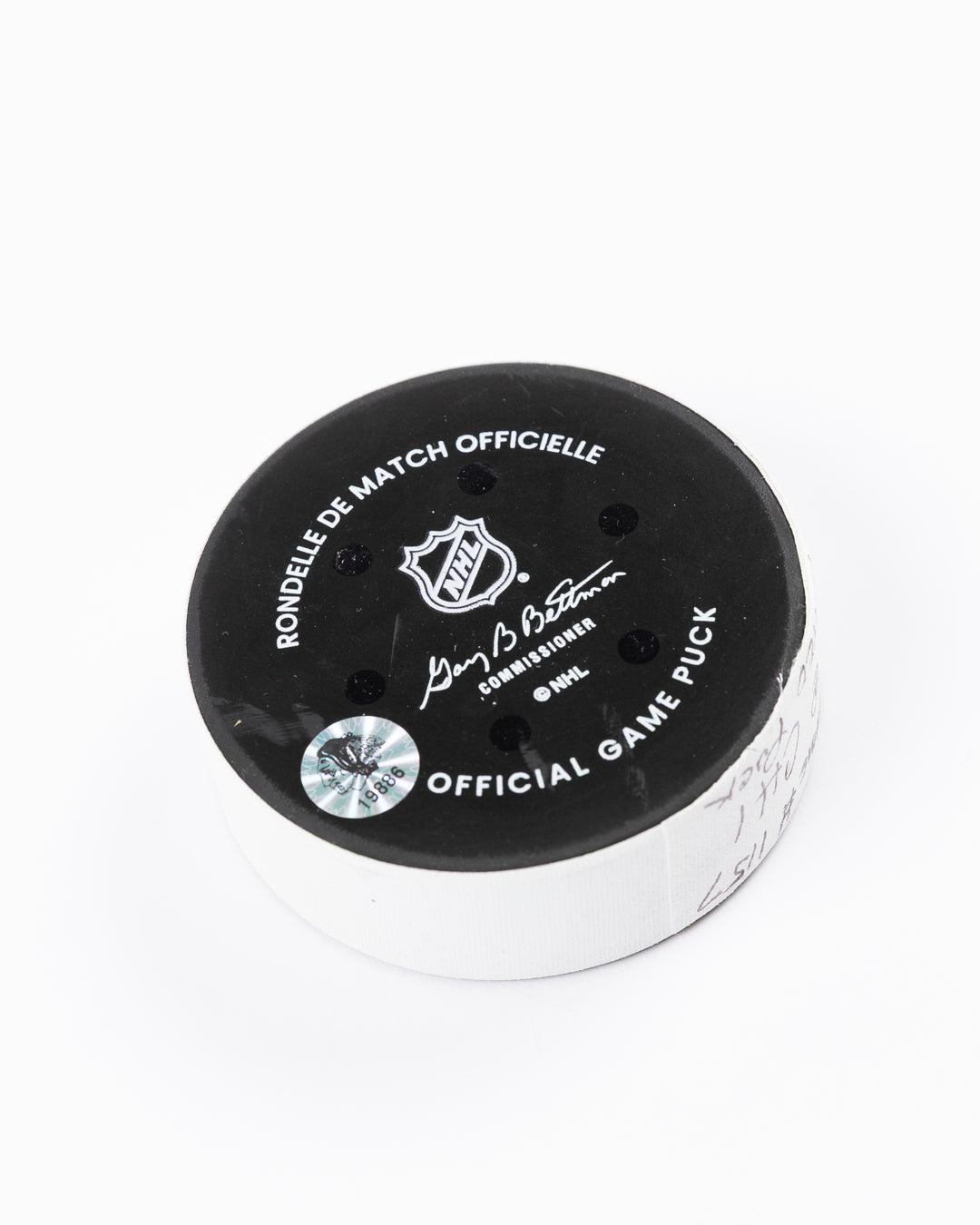 official Chicago Blackhawks hockey puck used in the game against the Vegas Golden Knights on 3/28/25 - back angle lay flat