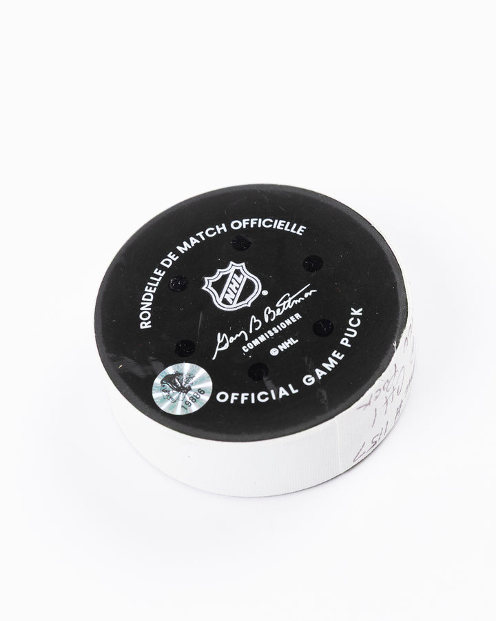 official Chicago Blackhawks hockey puck used in the game against the Vegas Golden Knights on 3/28/25 - back angle lay flat