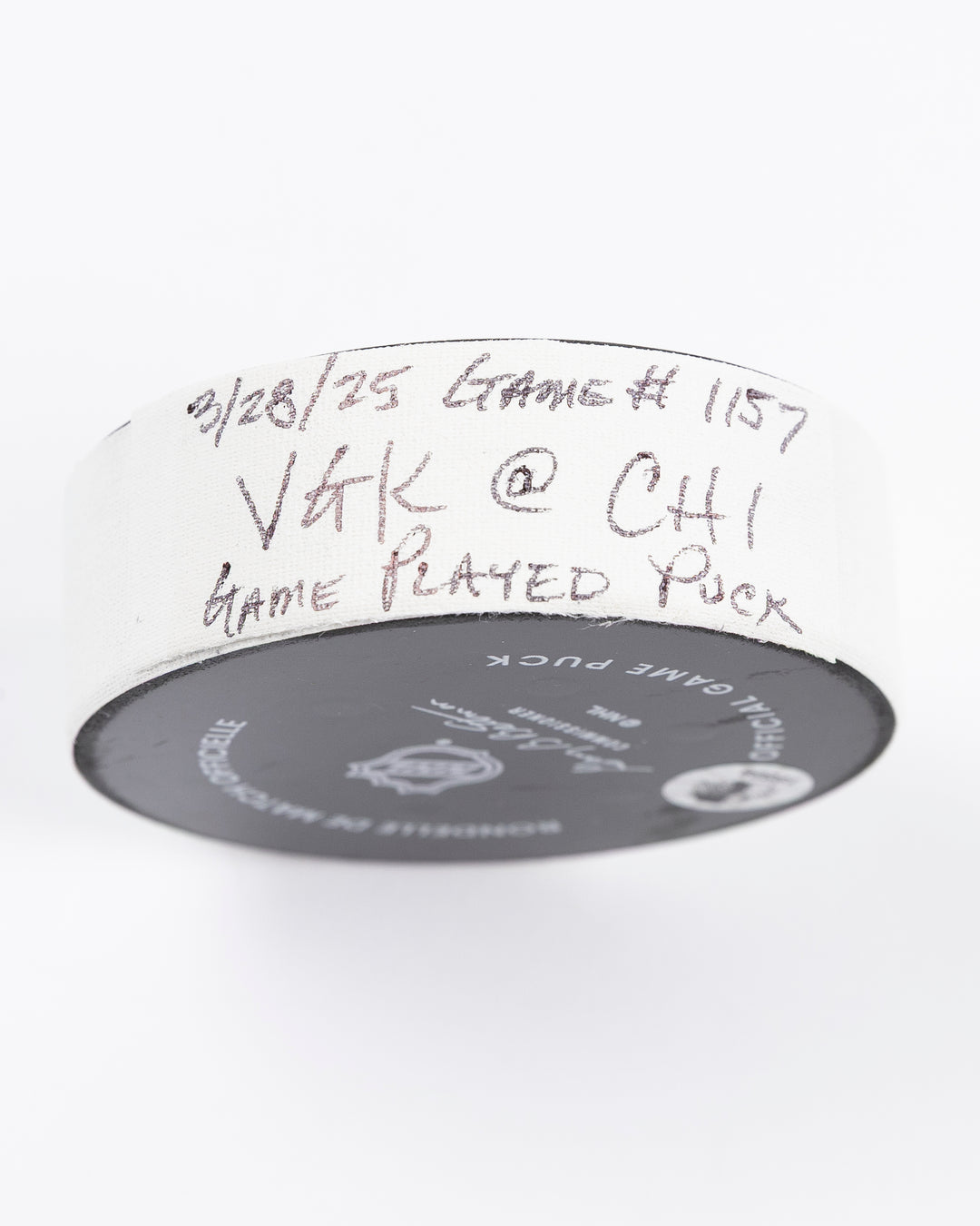 official Chicago Blackhawks hockey puck used in the game against the Vegas Golden Knights on 3/28/25 - tape detail lay flat