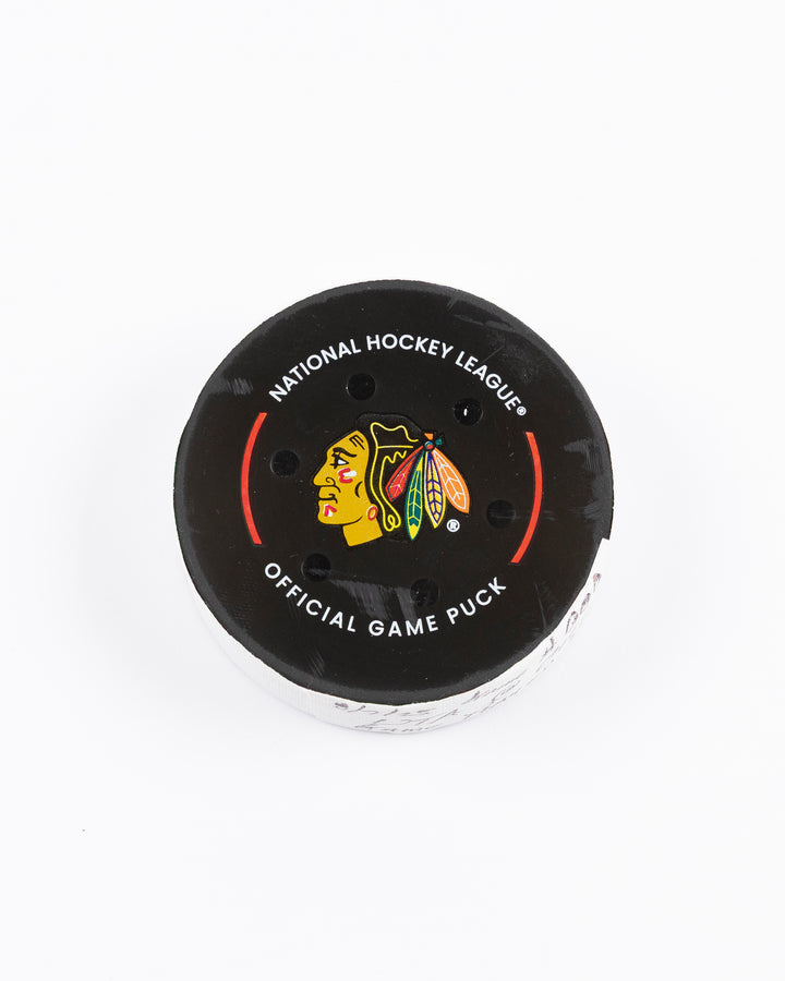 official Chicago Blackhawks hockey puck used in game against Utah Hockey Club on 3/7/25 - front lay flat