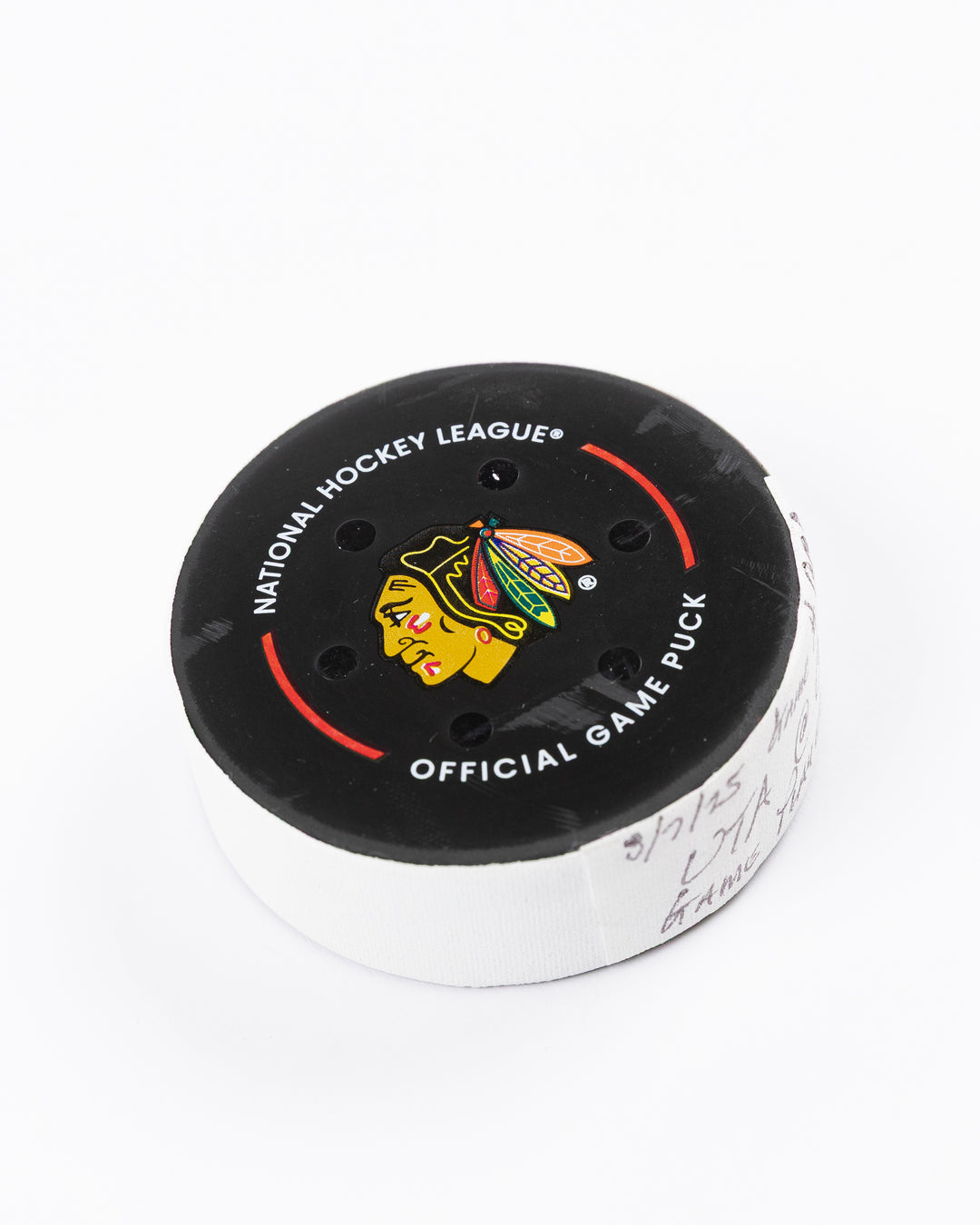 official Chicago Blackhawks hockey puck used in game against Utah Hockey Club on 3/7/25 - front angle lay flat