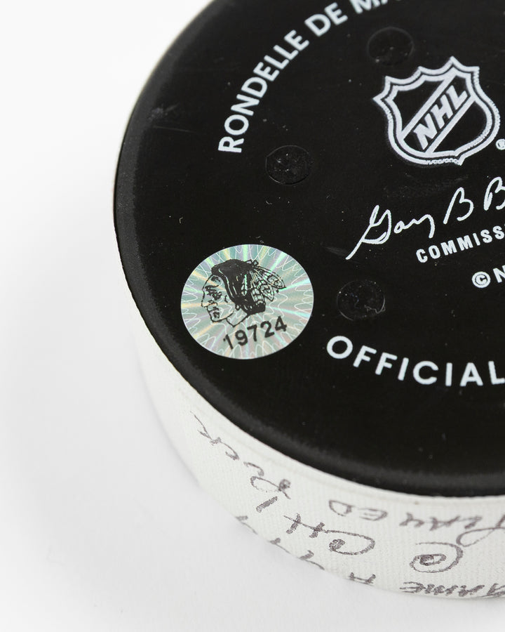 official Chicago Blackhawks hockey puck used in game against Utah Hockey Club on 3/7/25 - hologram sticker detail lay flat