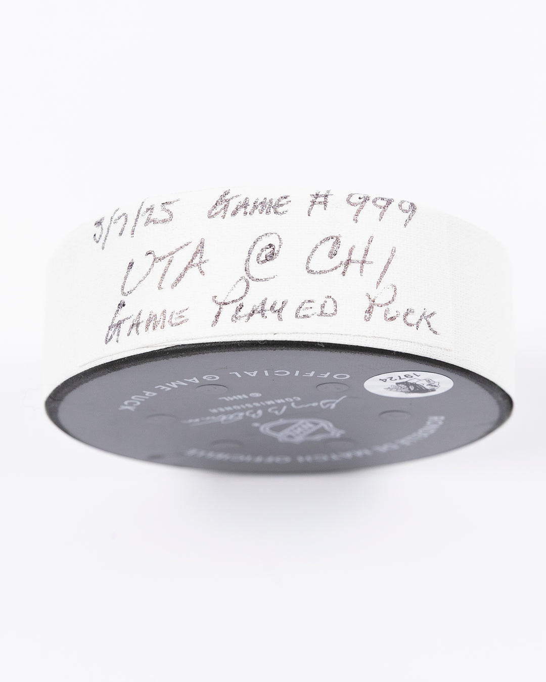 official Chicago Blackhawks hockey puck used in game against Utah Hockey Club on 3/7/25 - tape detail lay flat