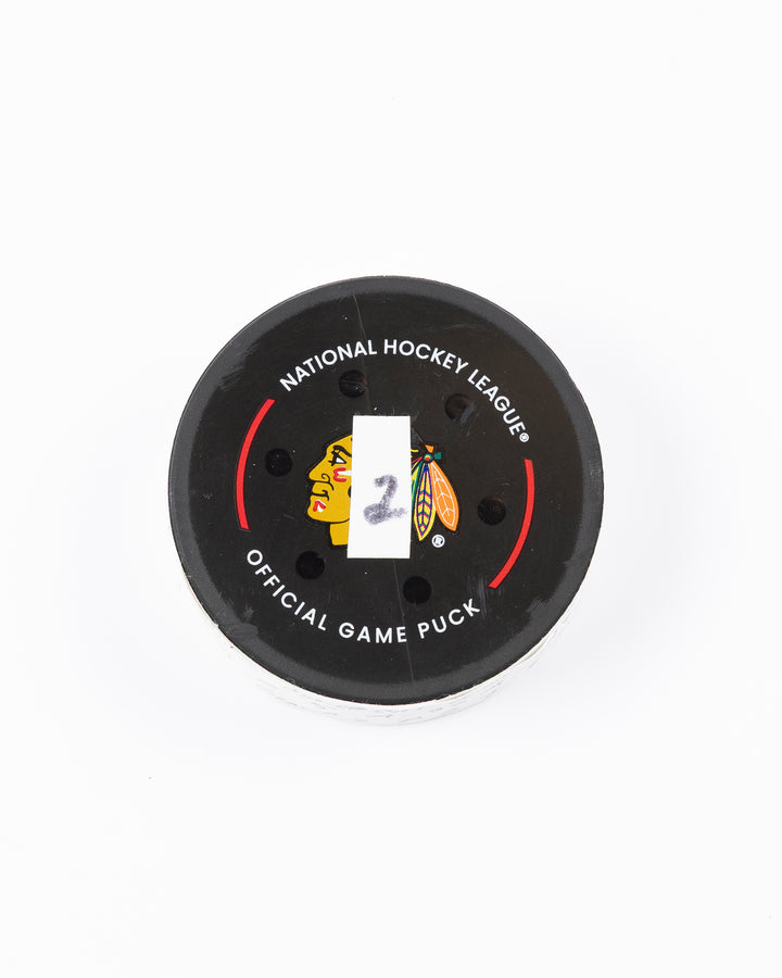 official hockey goal puck scored by Chicago Blackhawks player Connor Murphy  front lay flat