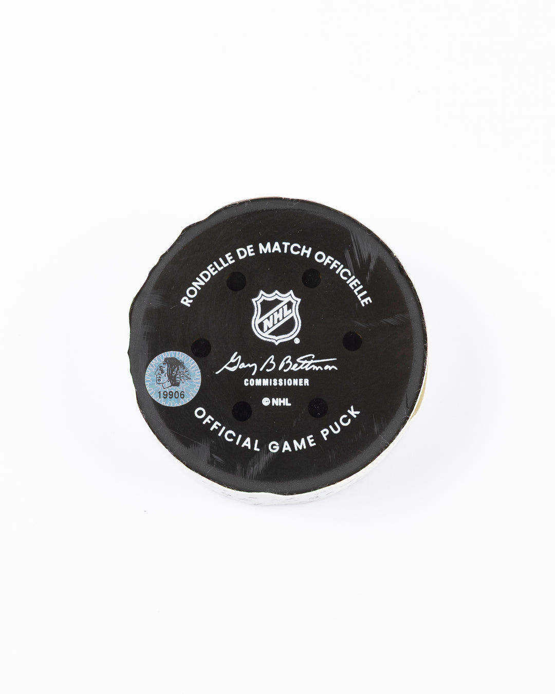 official hockey goal puck scored by Chicago Blackhawks player Connor Murphy  back lay flat