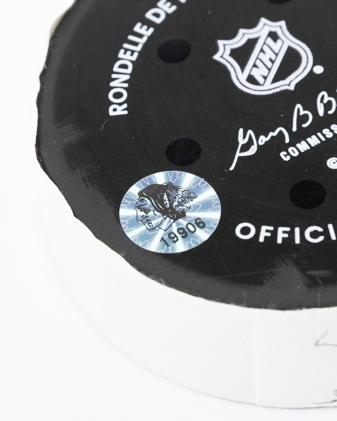official hockey goal puck scored by Chicago Blackhawks player Connor Murphy hologram sticker detail lay flat