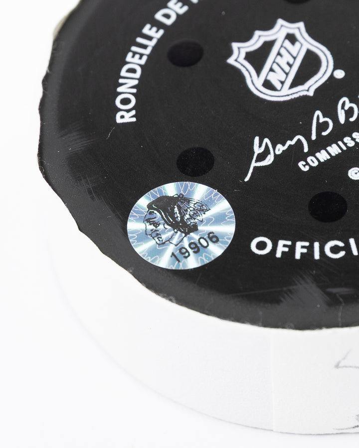 official hockey goal puck scored by Chicago Blackhawks player Connor Murphy hologram sticker detail lay flat