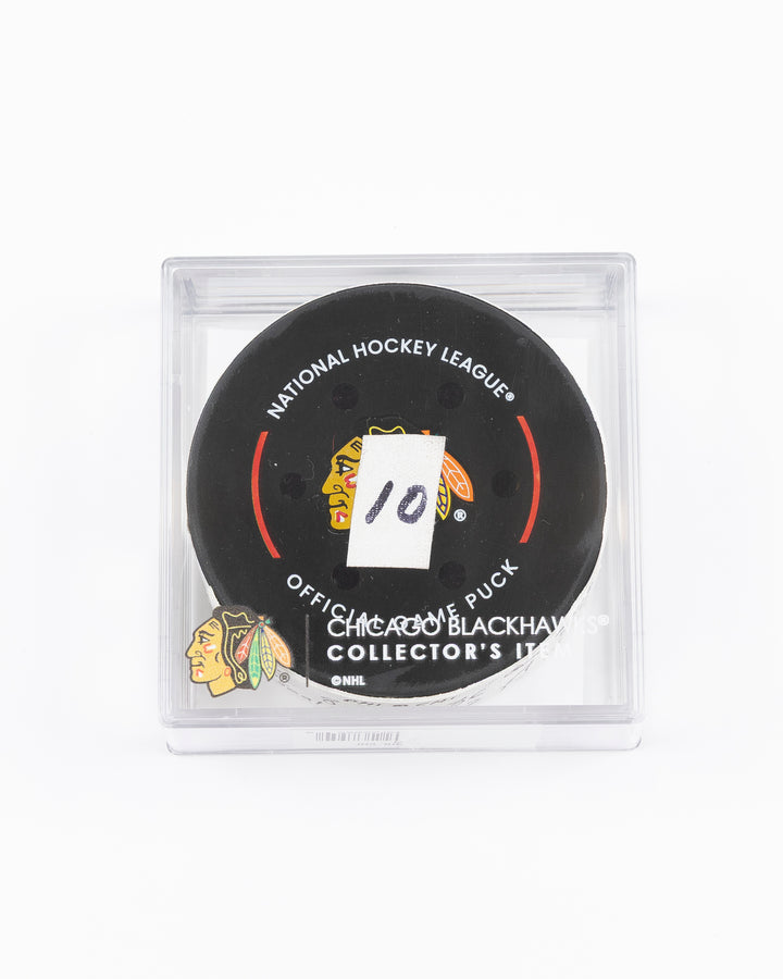 official hockey goal puck scored by Chicago Blackhawks player Ryan Donato on 3/23/25 - front lay flat in case