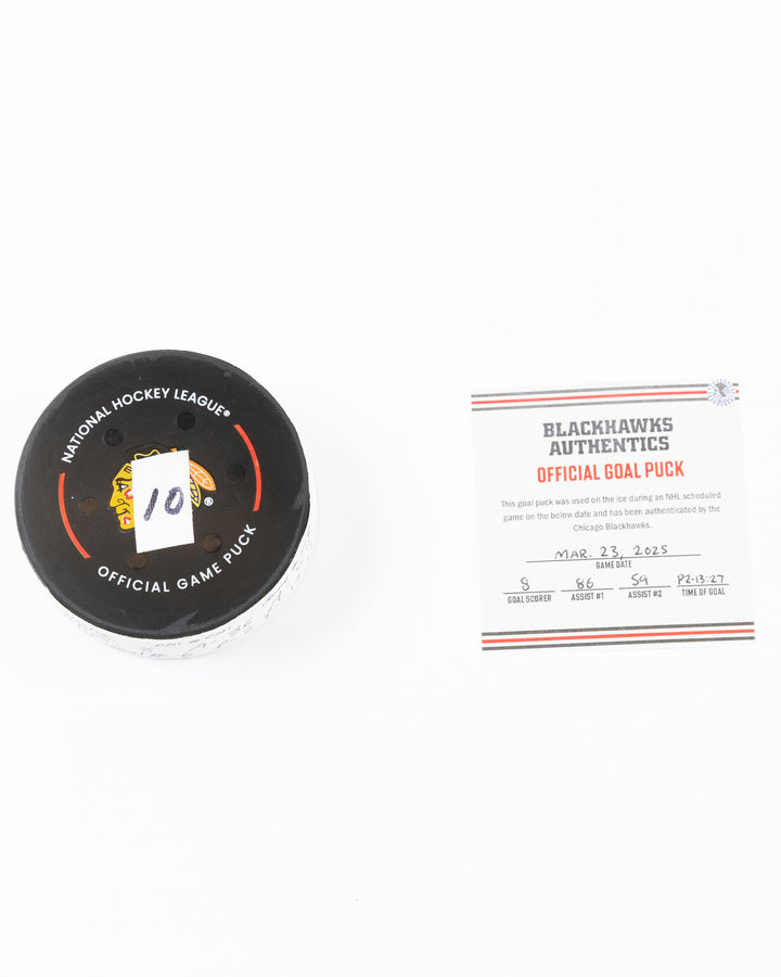 official hockey goal puck scored by Chicago Blackhawks player Ryan Donato on 3/23/25 - front lay flat puck and certificate