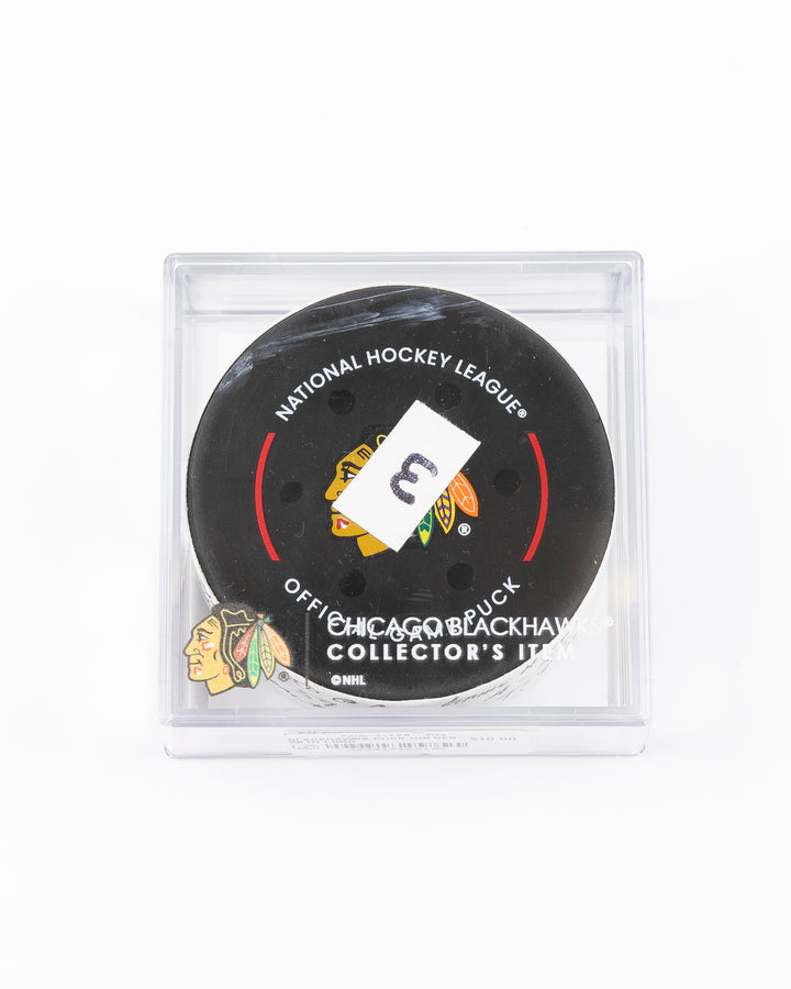 official hockey goal puck used by Chicago Blackhawks player Tyler Bertuzzi on 3/26/25 - front lay flat in case