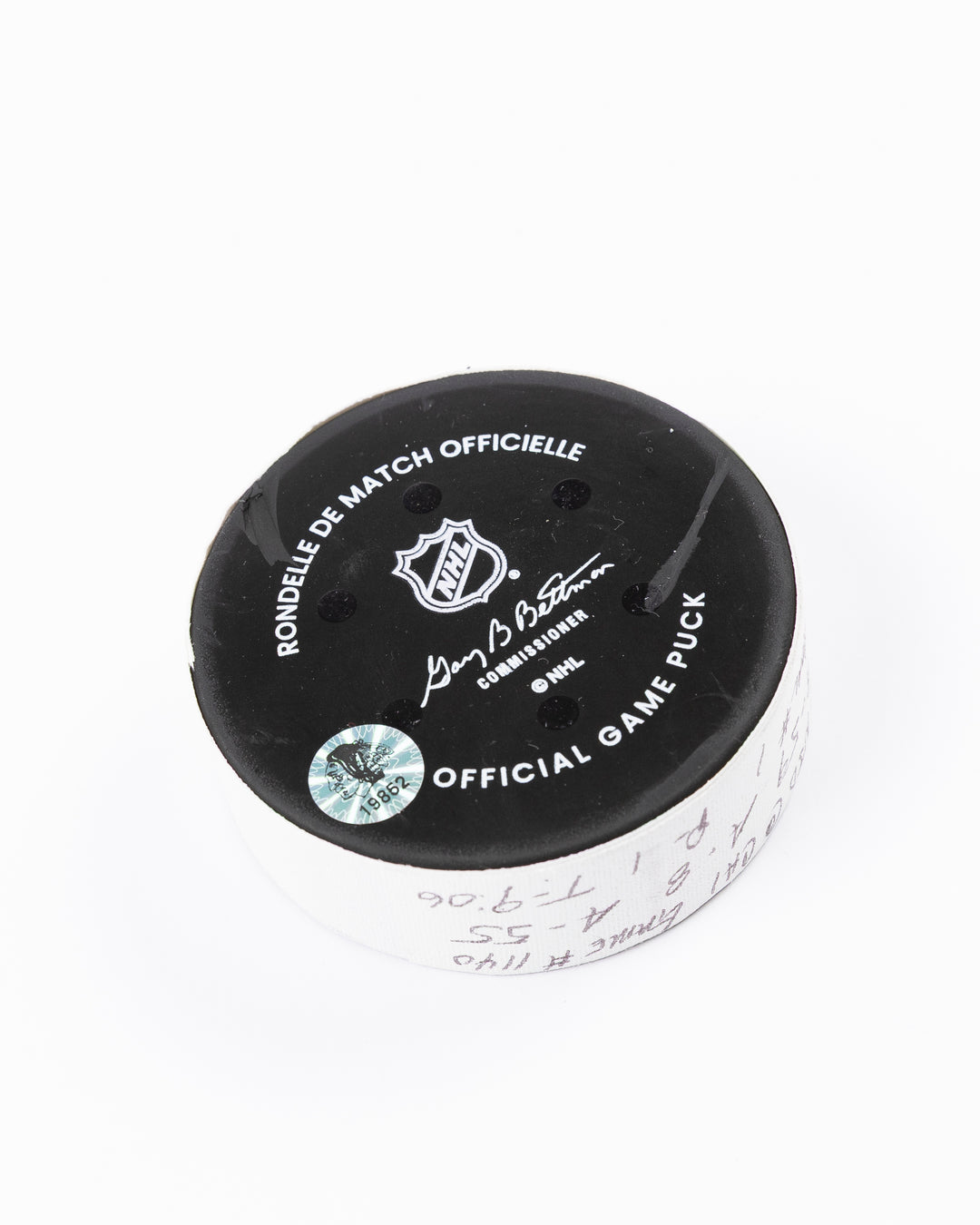 official hockey goal puck used by Chicago Blackhawks player Tyler Bertuzzi on 3/26/25 - back angle lay flat