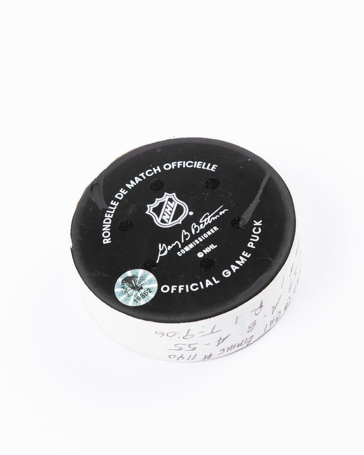 official hockey goal puck used by Chicago Blackhawks player Tyler Bertuzzi on 3/26/25 - back angle lay flat