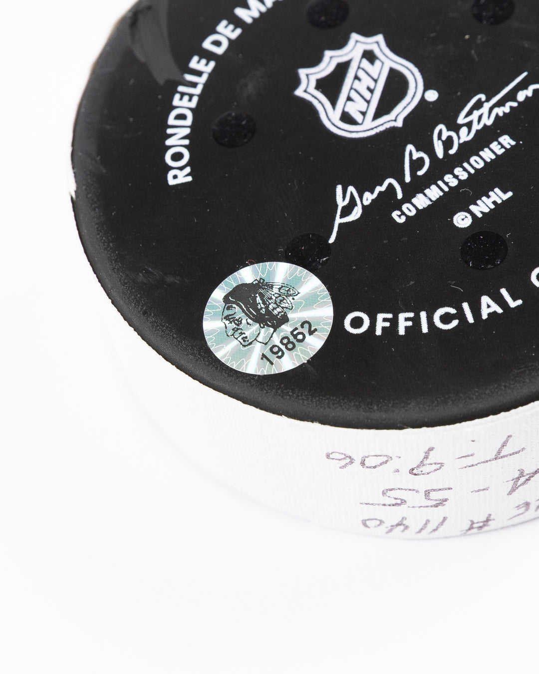 official hockey goal puck used by Chicago Blackhawks player Tyler Bertuzzi on 3/26/25 - hologram sticker detail lay flat