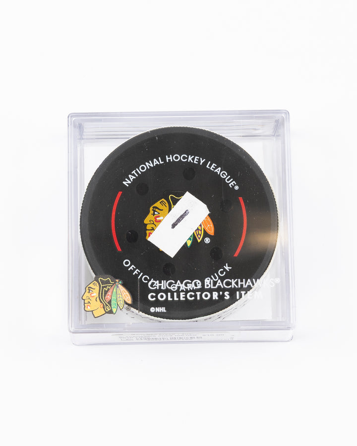 official hockey goal puck scored by Chicago Blackhawks player Joe Veleno on 3/28/25 - front lay flat in case