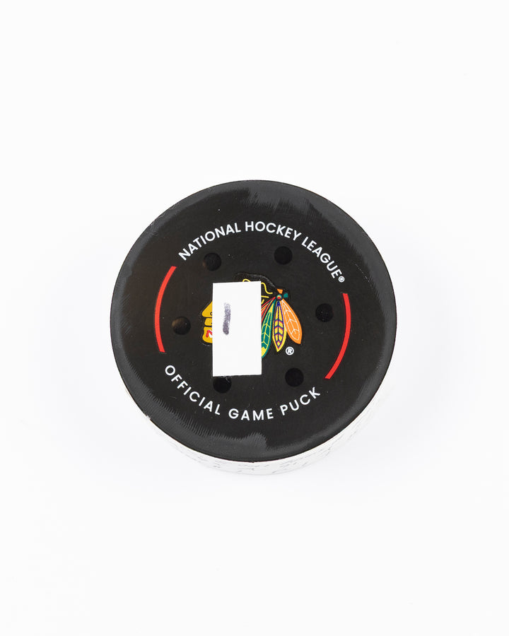 official hockey goal puck scored by Chicago Blackhawks player Ilya Mikheyev on 4/2/25 - front lay flat