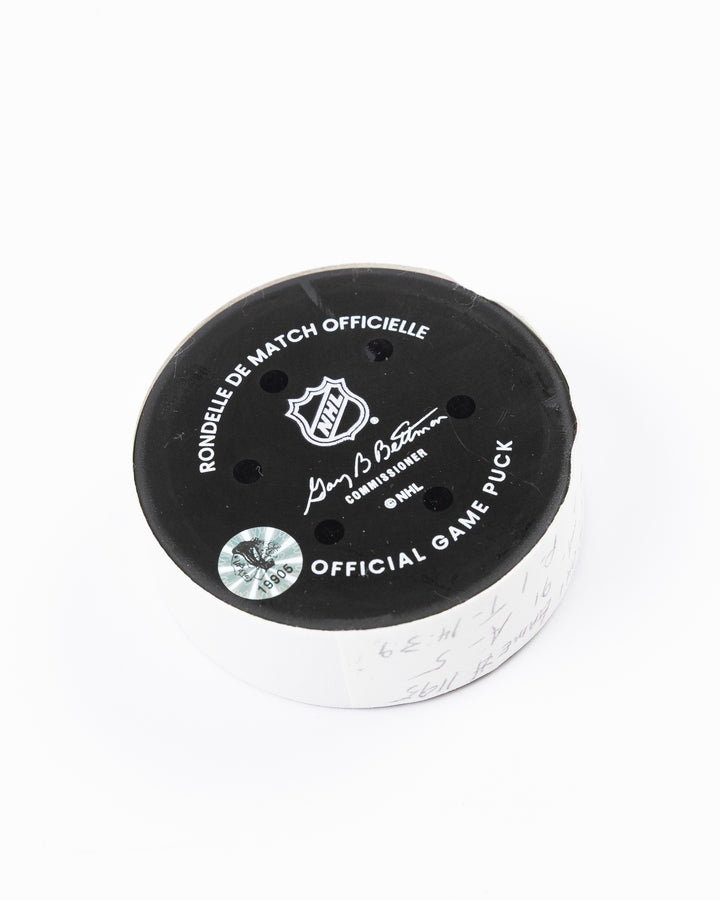 official hockey goal puck scored by Chicago Blackhawks player Ilya Mikheyev on 4/2/25 - back angle lay flat