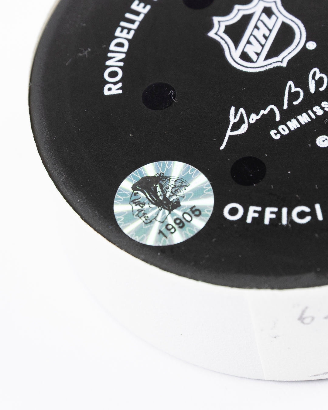 official hockey goal puck scored by Chicago Blackhawks player Ilya Mikheyev on 4/2/25 - hologram sticker detail lay flat