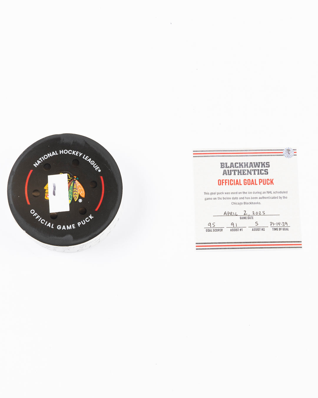 official hockey goal puck scored by Chicago Blackhawks player Ilya Mikheyev on 4/2/25 - front lay flat puck and certificate