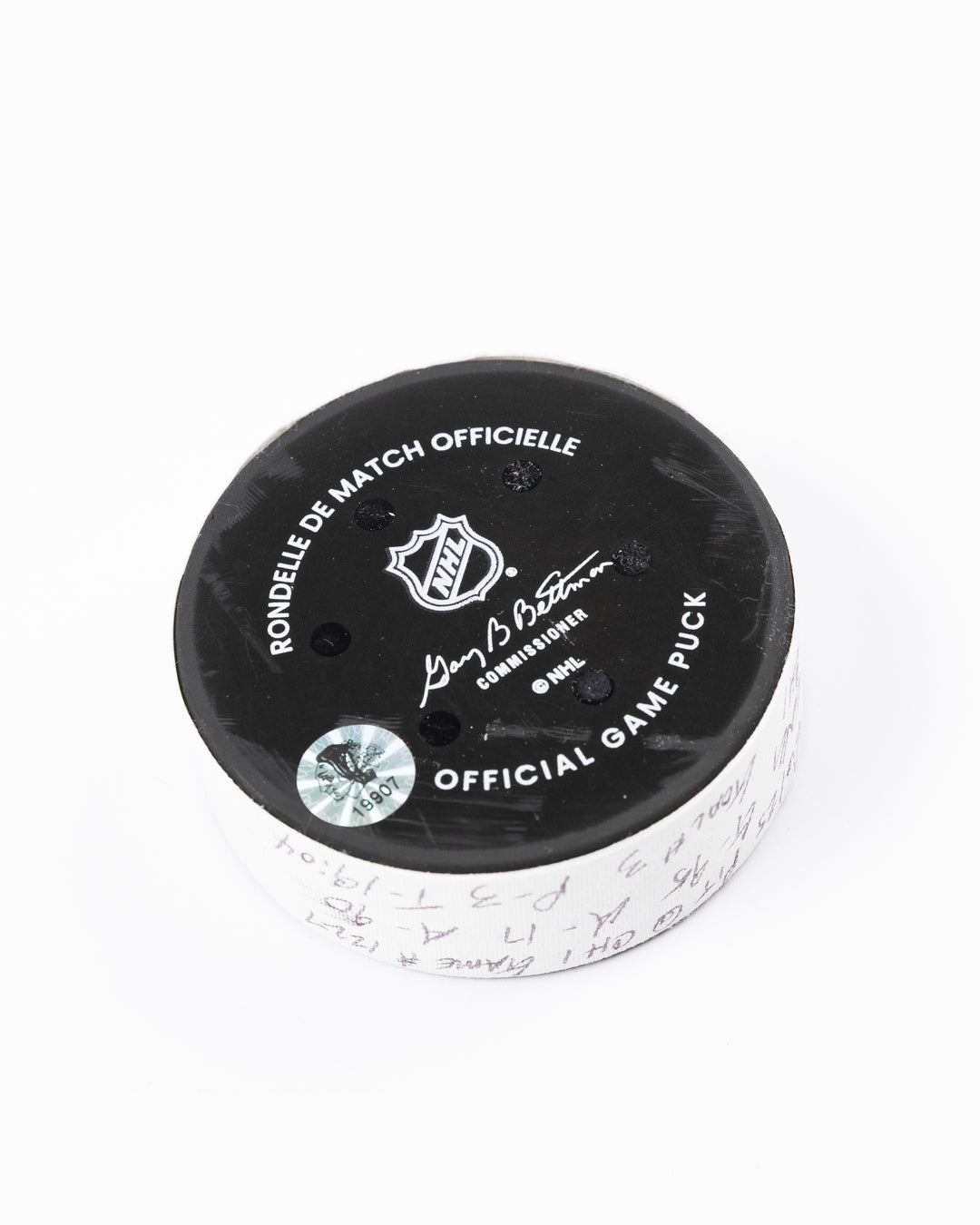 official hockey goal puck scored by Chicago Blackhawks player Ilya Mikheyev - back angle lay flat