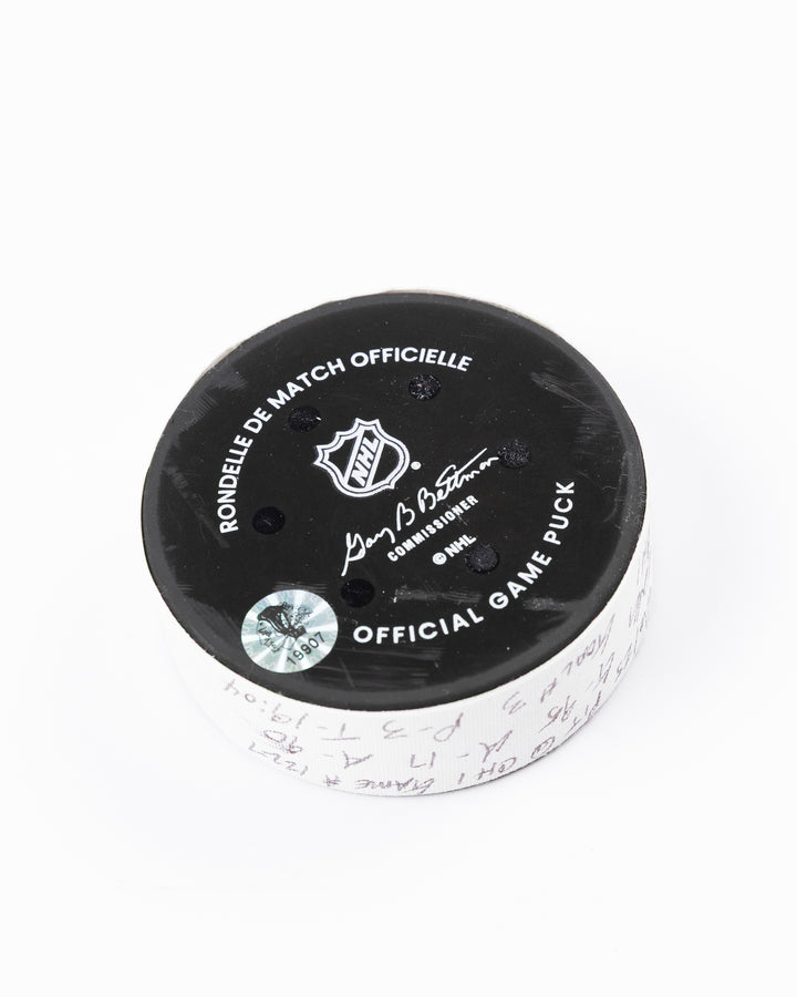 official hockey goal puck scored by Chicago Blackhawks player Ilya Mikheyev - back angle lay flat