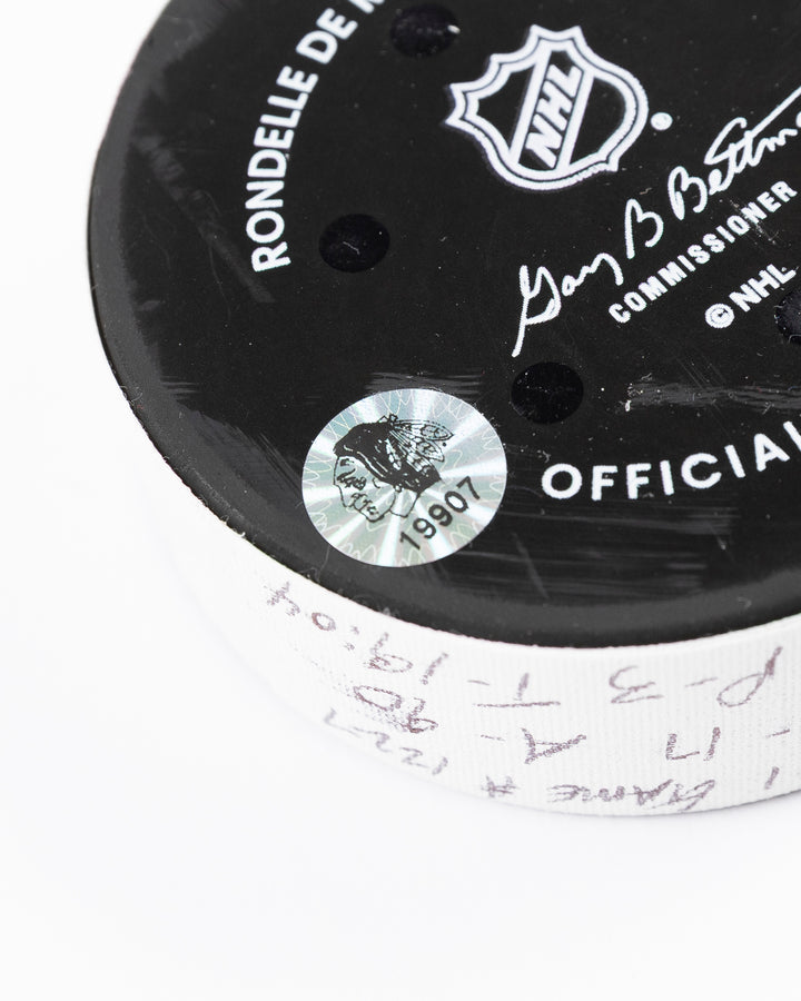 official hockey goal puck scored by Chicago Blackhawks player Ilya Mikheyev - hologram sticker detail lay flat