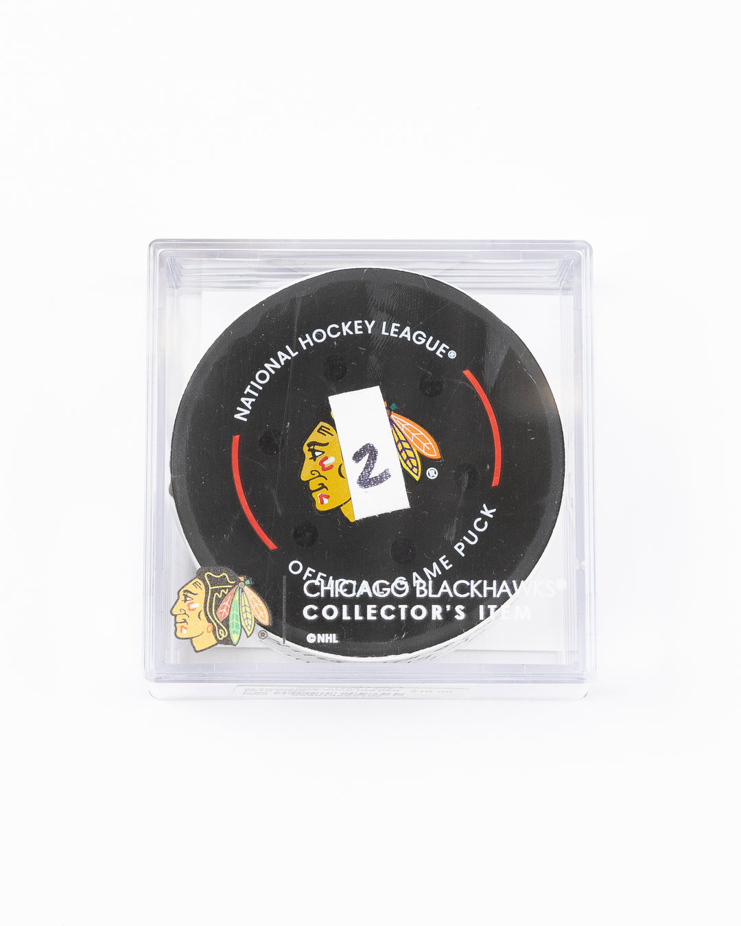 official game used hockey goal puck scored by Chicago Blackhawks player Wyatt Kaiser - front lay flat in case