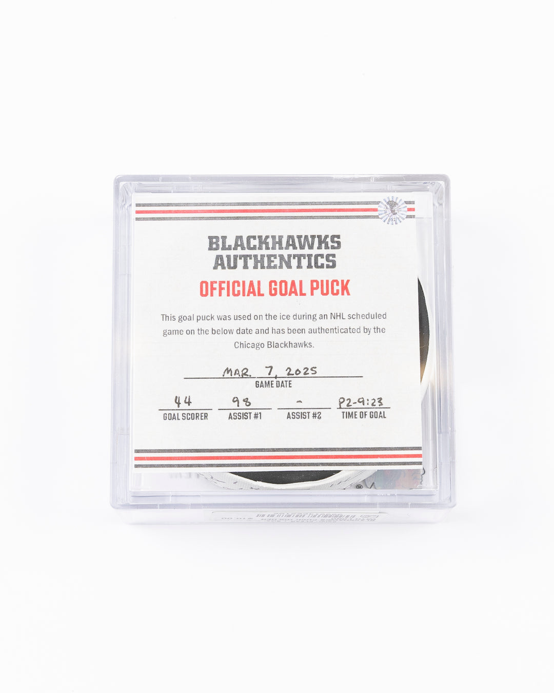 official game used hockey goal puck scored by Chicago Blackhawks player Wyatt Kaiser - front lay flat in case with certificate