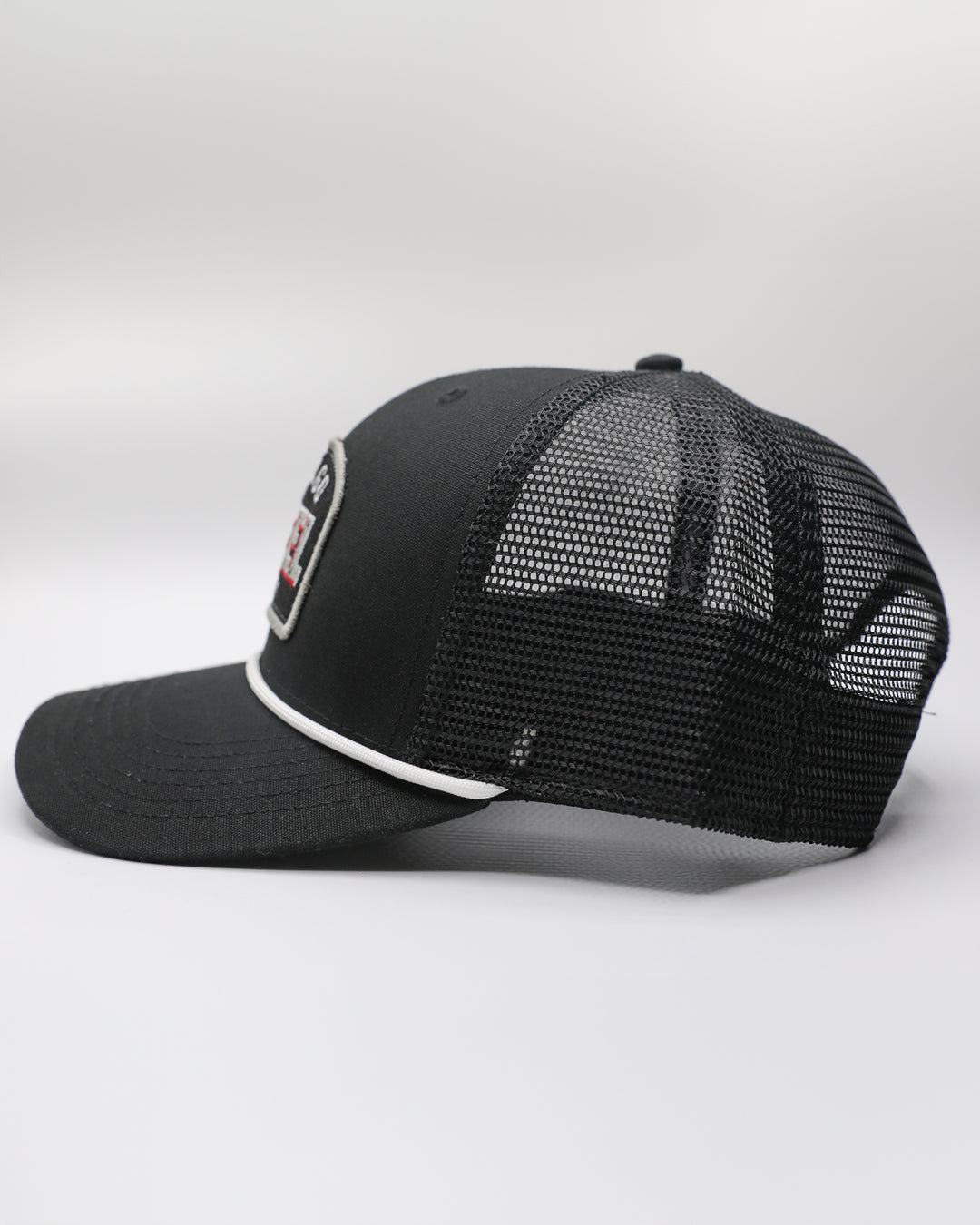 black rope trucker cap with Chicago Steel hockey patch embroidered on front - left side lay flat