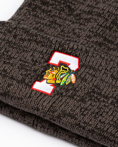 black marled knit '47 beanie with embroidered 7 and Chicago Blackhawks primary logo on front cuff - detail lay flat