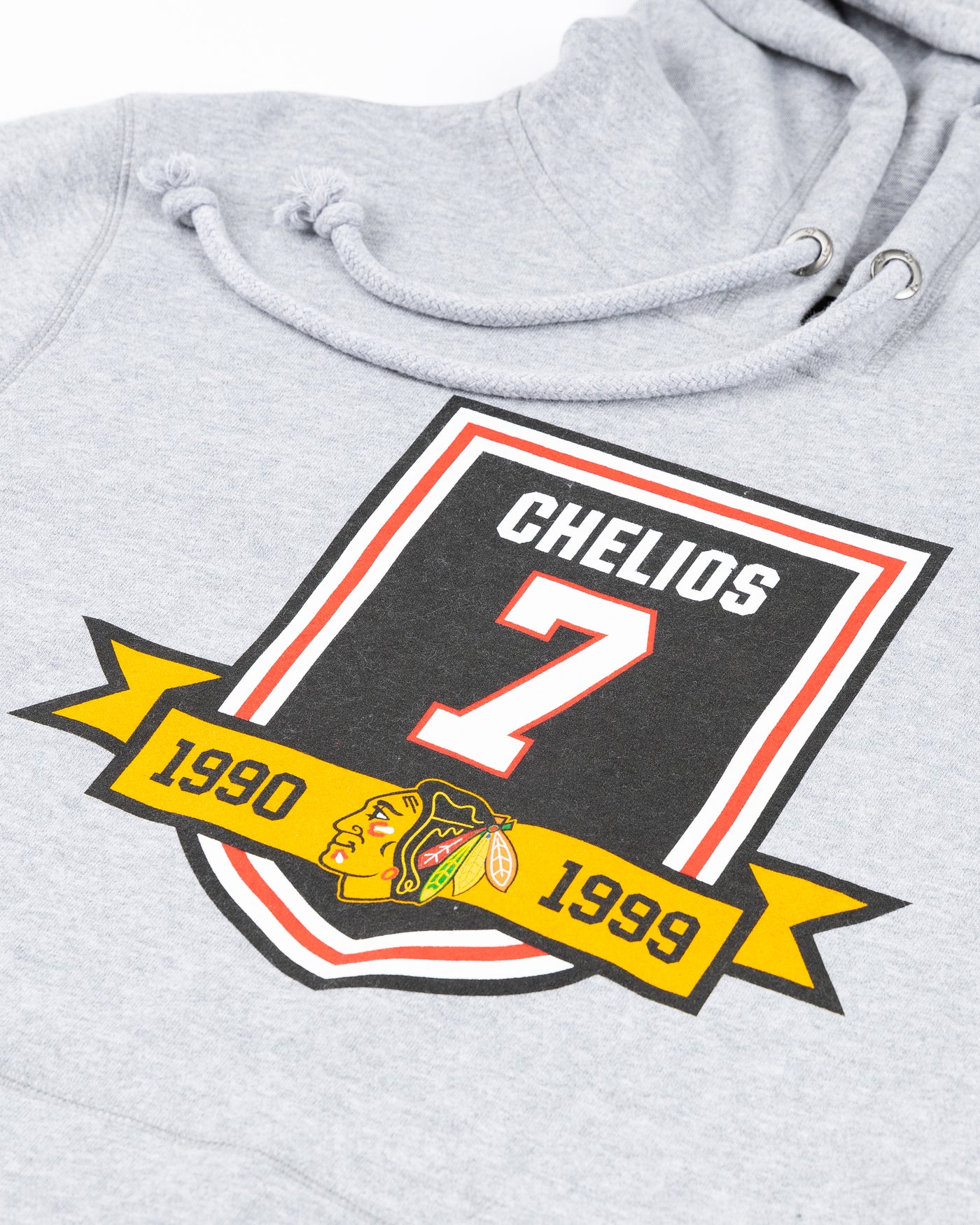 grey '74 brand hoodie with Chicago Blackhawks Chelios retirement banner inspired design on front - detail lay flat