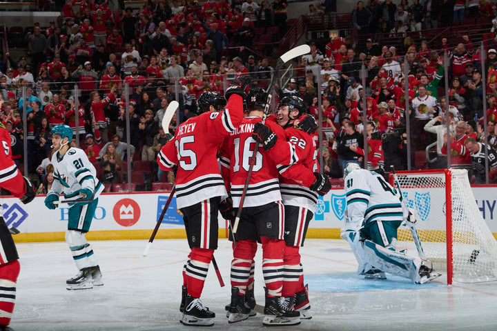 Jason Dickinson celebrating after score during Chicago Blackhawks game on October 17, 2024 