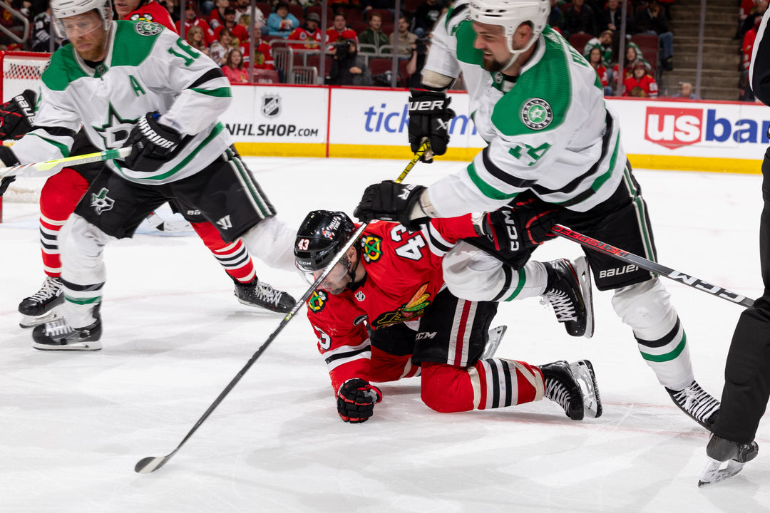 Chicago Blackhawks player on ice with Dallas Stars