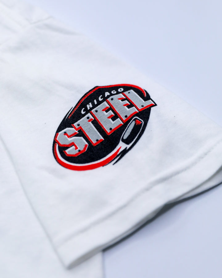 youth short sleeve tee in white with Chicago Steel logo on left shoulder and eras graphic across front - shoulder detail lay flat