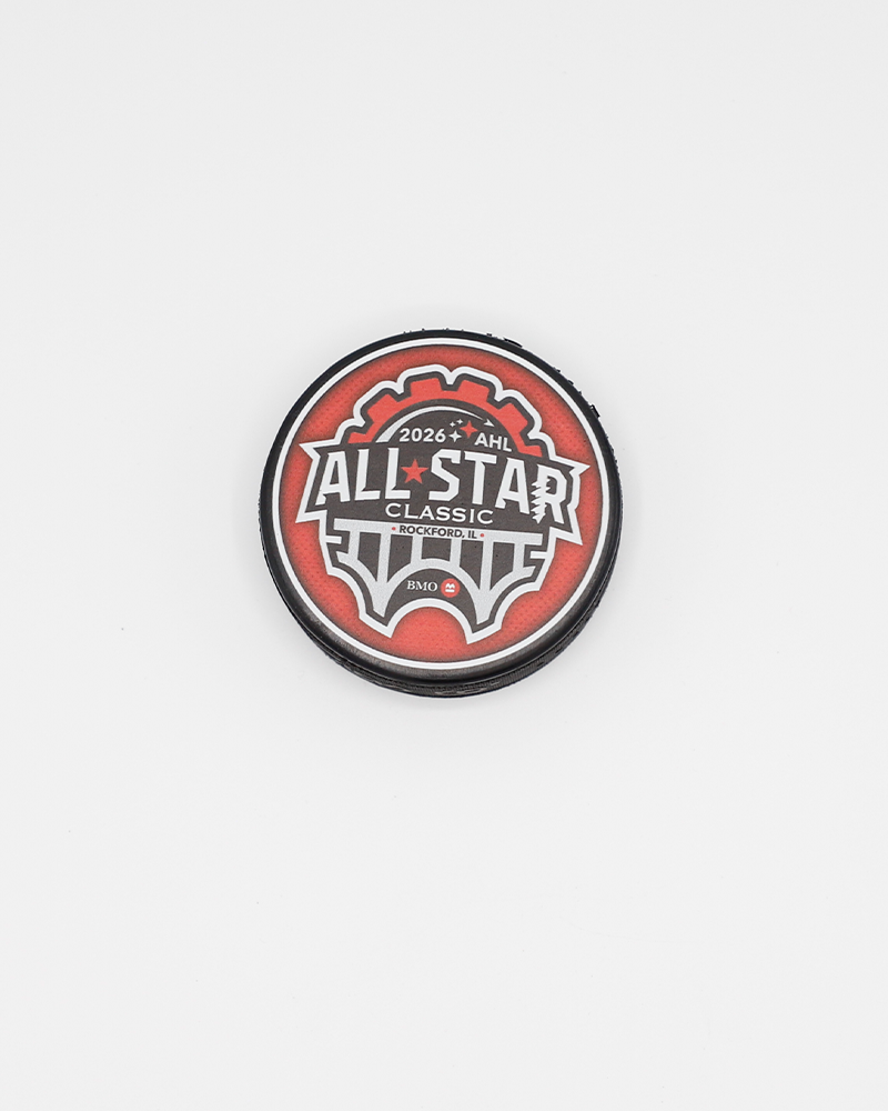 black hockey puck with 026 AHL All Star Classic graphic on red background on front - front lay flat