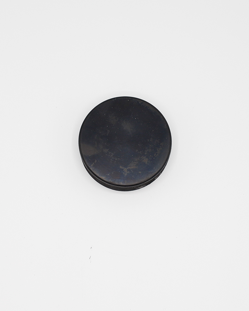 black hockey puck with Rockford IceHogs Hammy underneath a Bickell 44 graphic - back lay flat