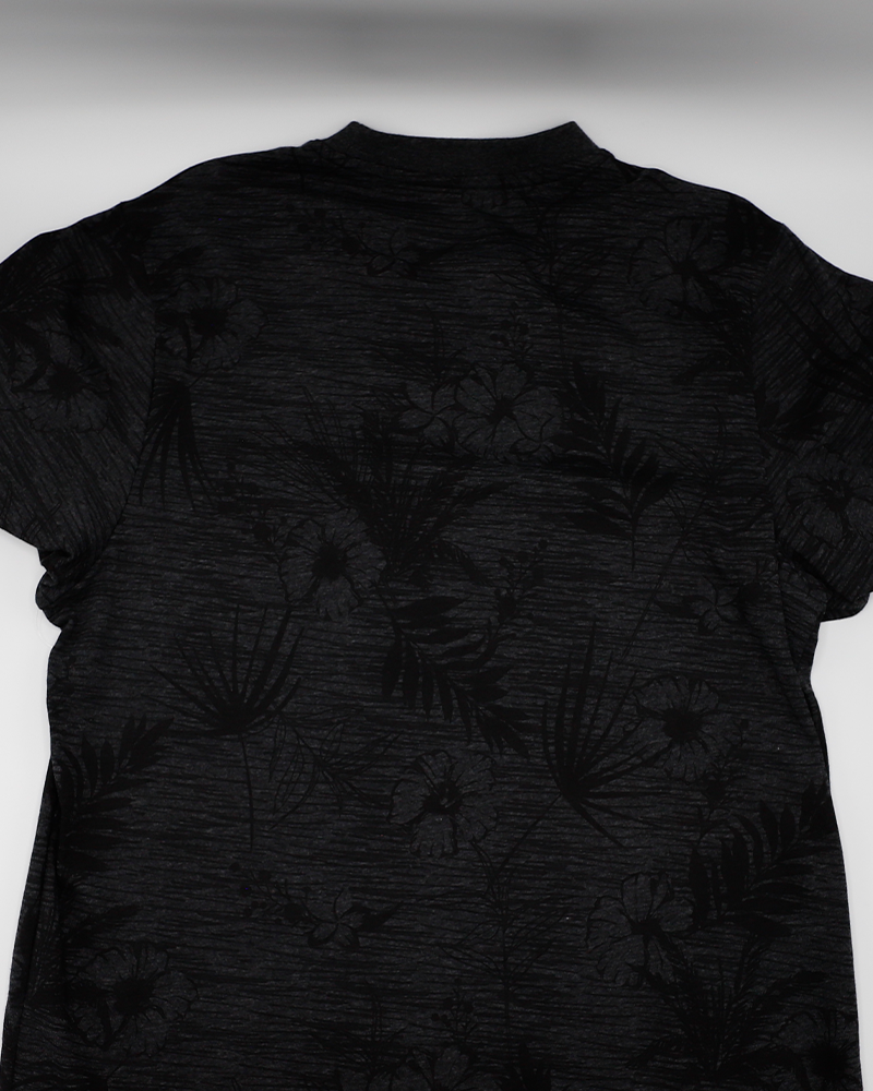 Colosseum collard short sleeve tee with black floral all over pattern with Rockford IceHogs primary logo on left chest - back lay flat