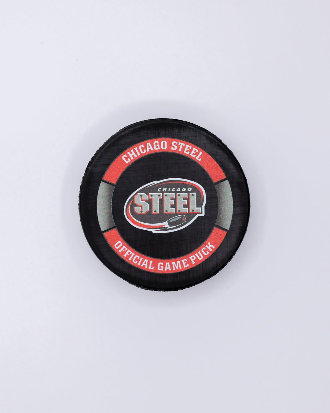 official game hockey puck of the Chicago Steel - front lay flat