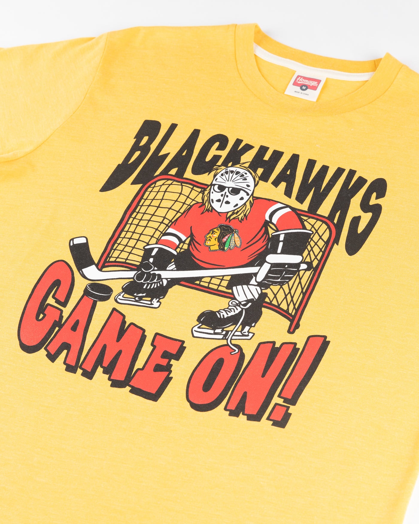 yellow Homage Chicago Blackhawks tee with Wayne's World inspired graphic on front - detail lay flat