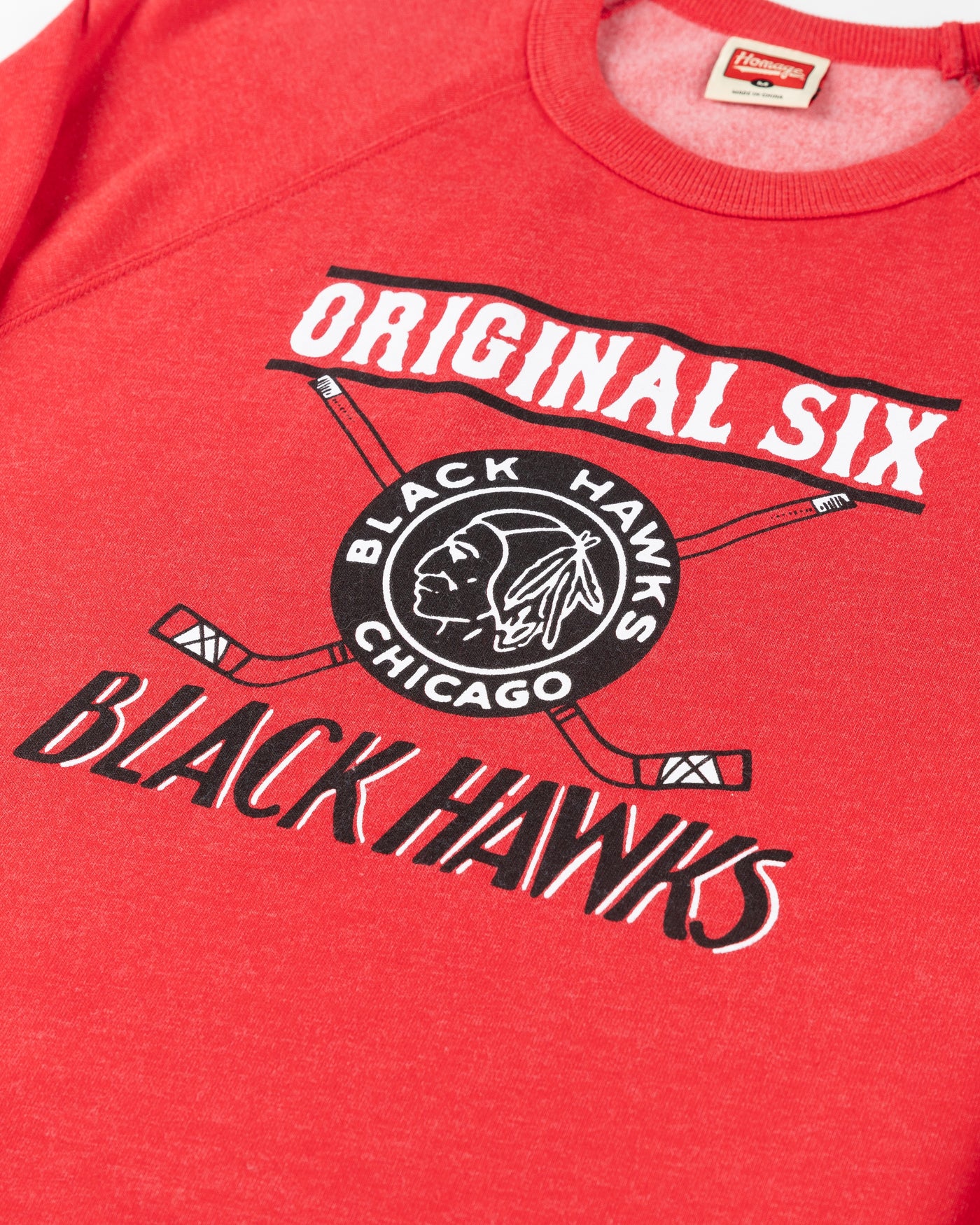 red Homage Chicago Blackhawks crewneck with vintage logo and Original Six wordmark graphic across front - detail lay flat