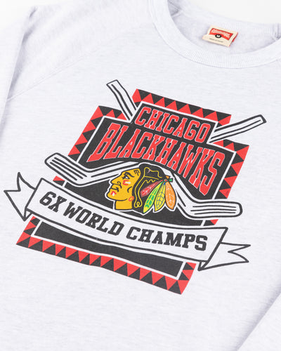 ash grey Homage crewneck with Chicago Blackhawks graphic 6x world champs - detail lay flat